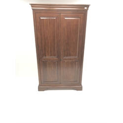  French cherry wood double wardrobe, projecting cornice, two doors enclosing single shelf and hanging rail, shaped plinth base, W118cm, H198cm, D64cm  