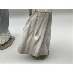 Three Lladro figures, comprising, Dreams of Summer Past no 6401, Spring Breeze no 4936 and Breezy Afternoon 5682 together with Lladro plaque Art Brings us Together no 7677, all in original boxes, largest example H35cm