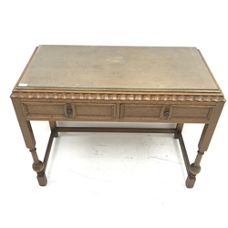 E. Gomme Ltd of High Wycombe oak side table, moulded top, two drawers, turned supports joined by stretchers, W106cm, H79cm, D50cm 