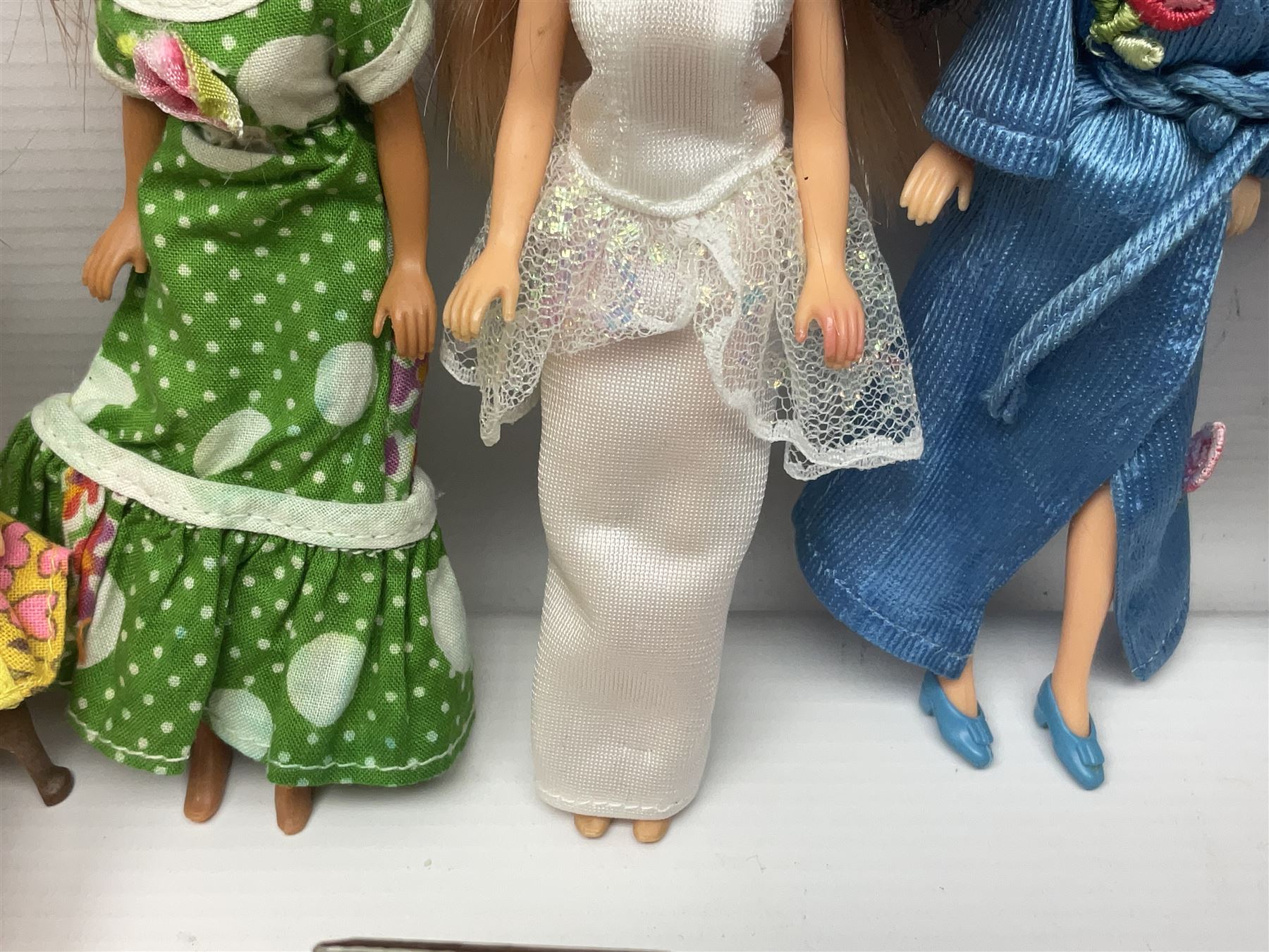 Seven Pippa dolls and a collection of plastic dolls house furniture