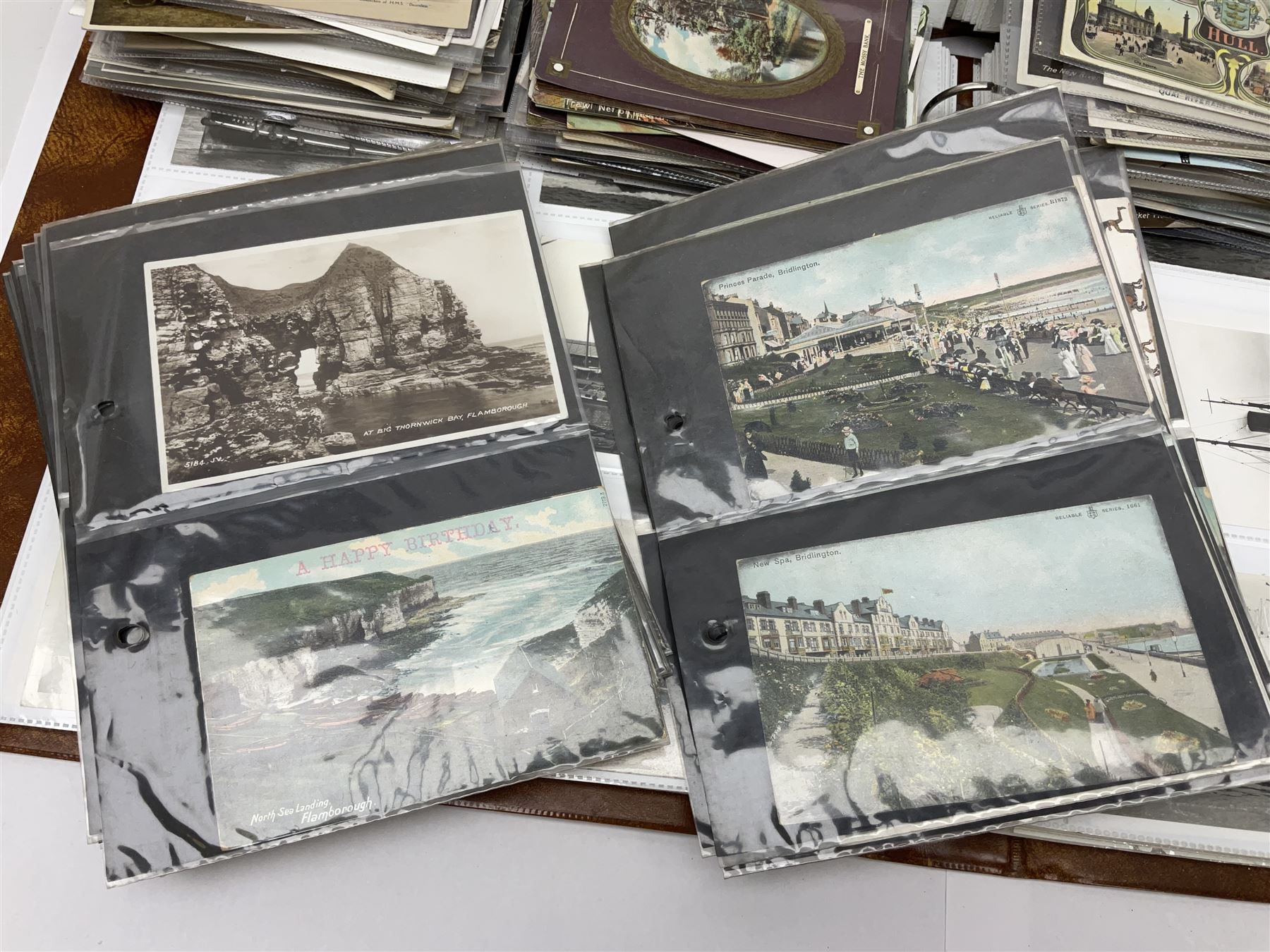 Collection of loose Edwardian and later postcards, mostly topographical examples depicting East Yorkshire, Hull and the East Coast, including Hull, Bridlington, Staithes, Flamborough Head, Beverley, etc., and a quantity of other postcards, plus two photograph albums containing photographs of trawlers
