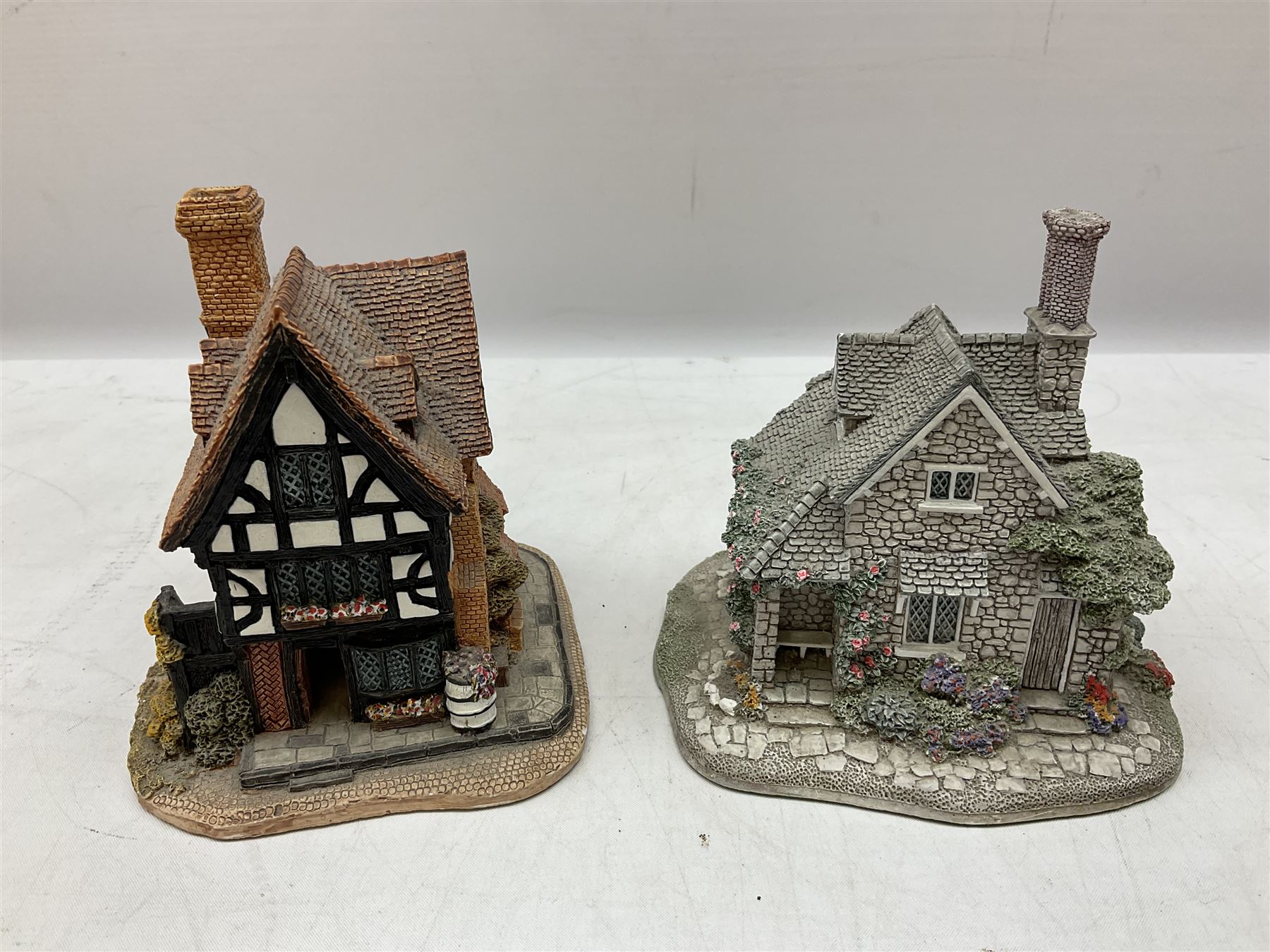 Eleven Lilliput Lane models, to include St Marks, Rose Cottage, Puffin Row, Village School, Swan Inn etc, all boxed