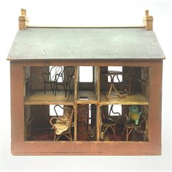 Victorian pine doll's house of double fronted two-storey form with brick painted facade and chimney stacks and grey painted pitched roof, the central four-panel door opening to reveal a hall with tin-plate staircase and privy under, landing and two rooms on each floor with glazed windows and fire-surrounds, some scrap-work to the interior and three removable panels to the back; together with small quantity of later oversized furniture H57cm W57cm D25cm