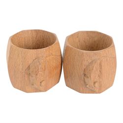 Mouseman - pair of oak napkin rings, of bulbous octagonal form, with carved mouse signature, by the workshop of Robert Thompson, Kilburn, W4.5cm