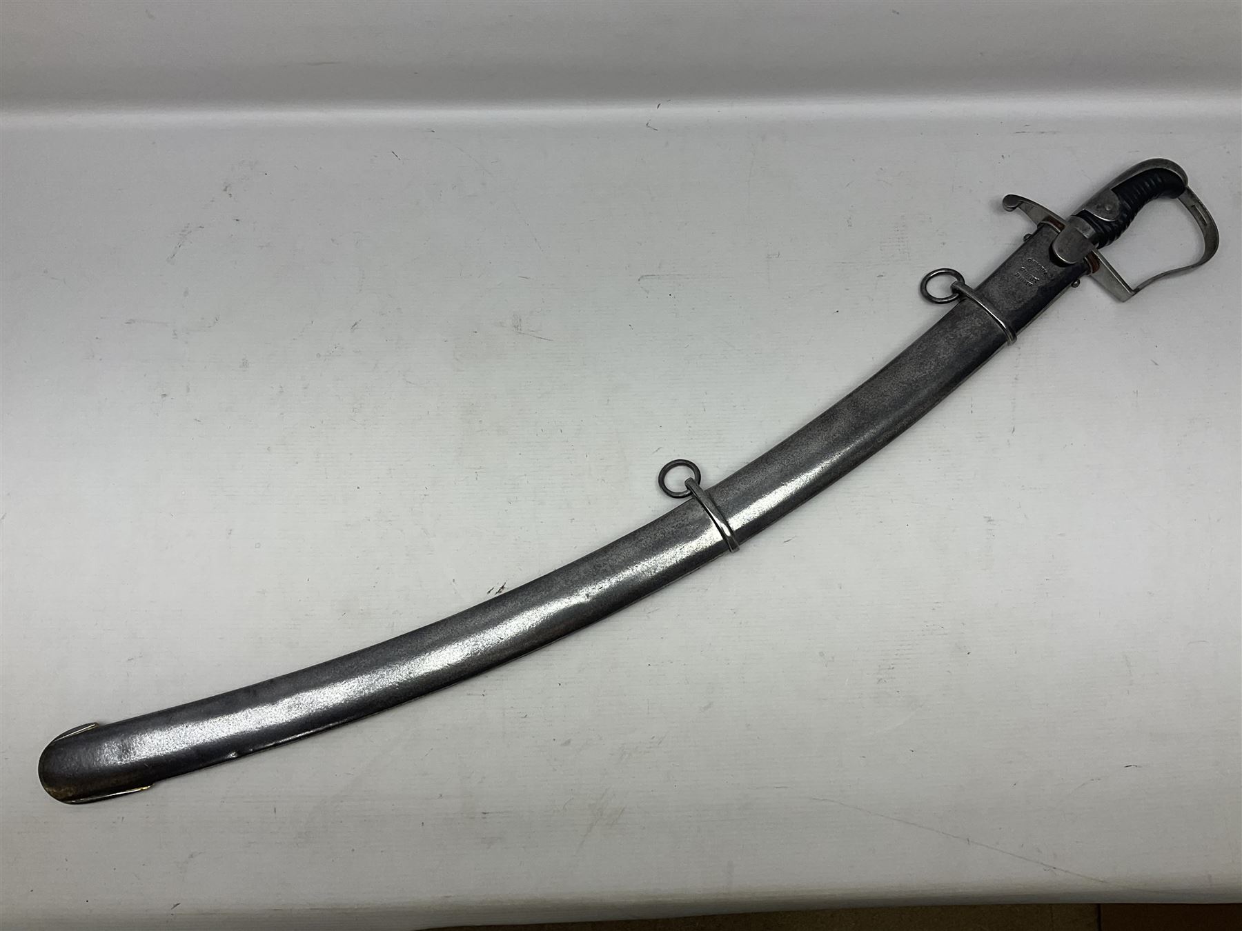 British 1796 Pattern Light Cavalry trooper's sword, the 84cm curving fullered blade stamped Hadley.1 to the back edge, steel hilt with knucklebow, D-shaped langets and leather grip; in polished steel scabbard stamped Osborn & Gunby Birmm. and W.R.16 ( ?16th Light Dragoons) with two suspension rings L100cm overall