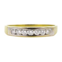 18ct gold channel set seven stone round brilliant cut diamond ring, stamped 750