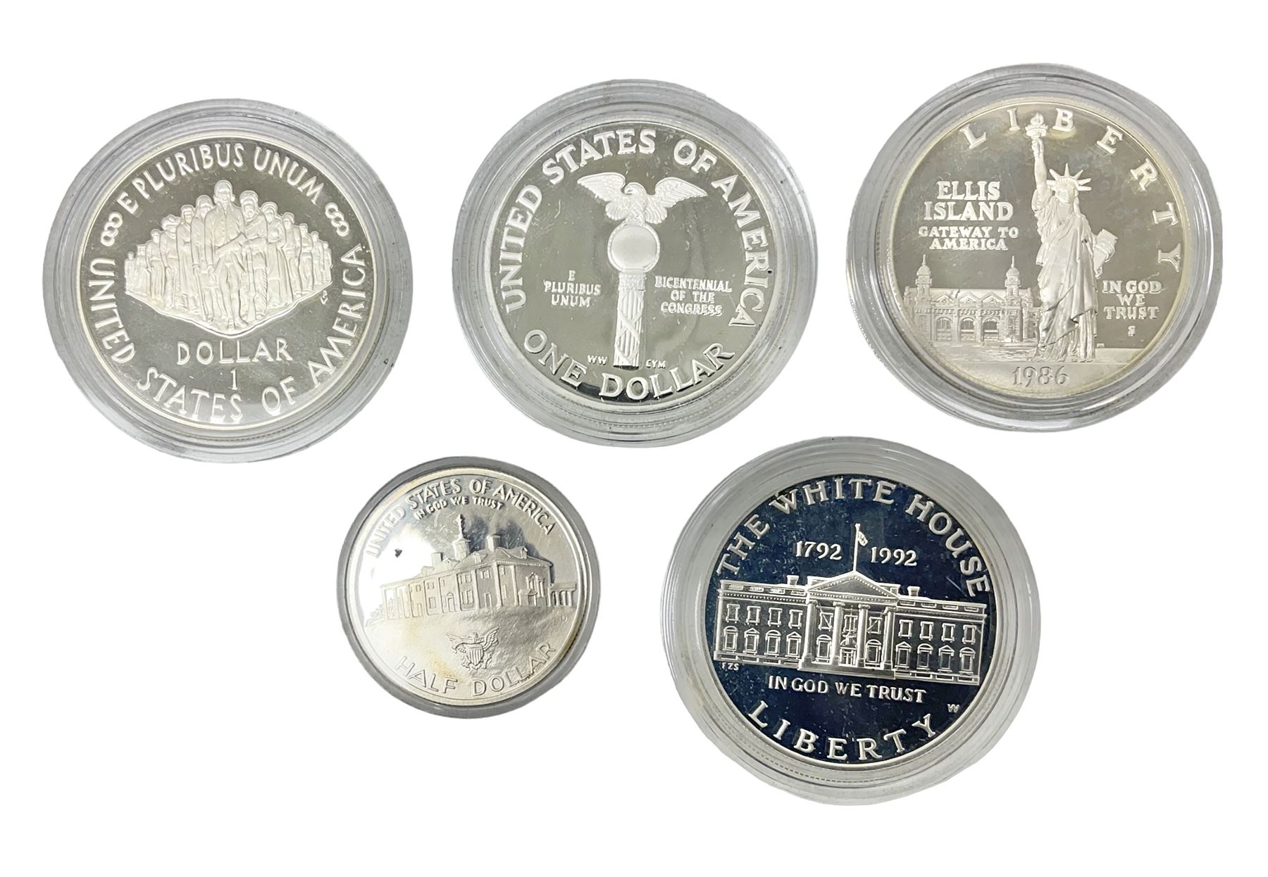 Five United States of America commemorative silver proof coins, comprising 1986, 1987, 1989, 1992 one dollars and 1982 half dollar, all with certificates