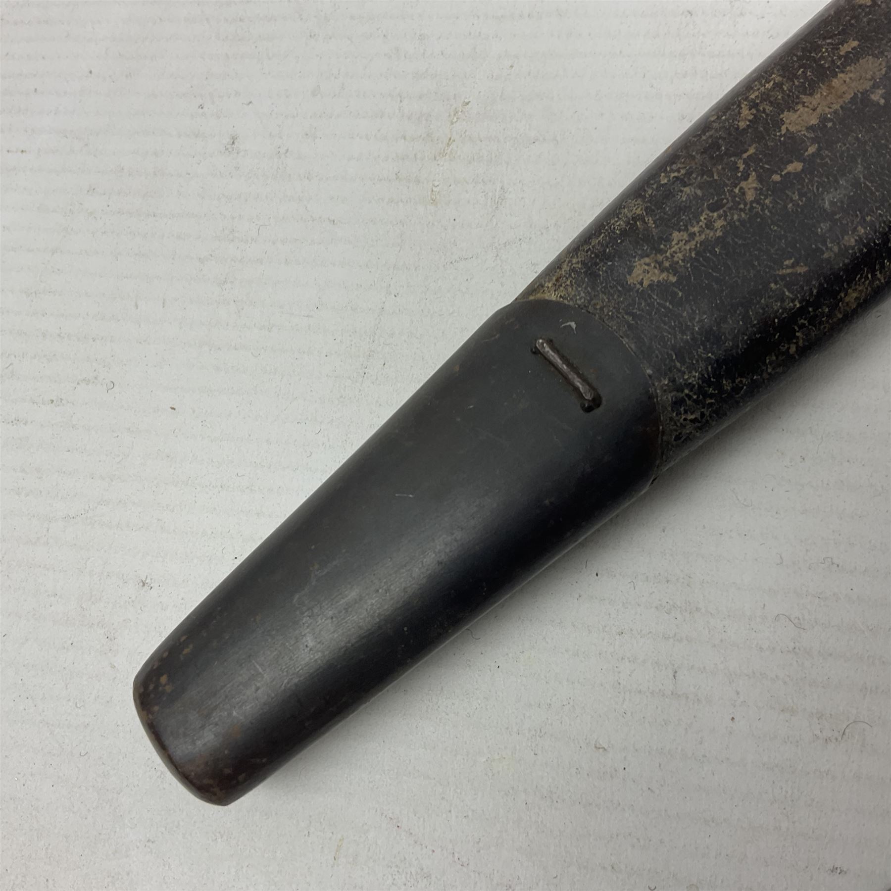 British Pattern 1888 knife bayonet, the 30.5cm double edged blade with raised central medial ridge; in leather covered scabbard L40.5cm overall