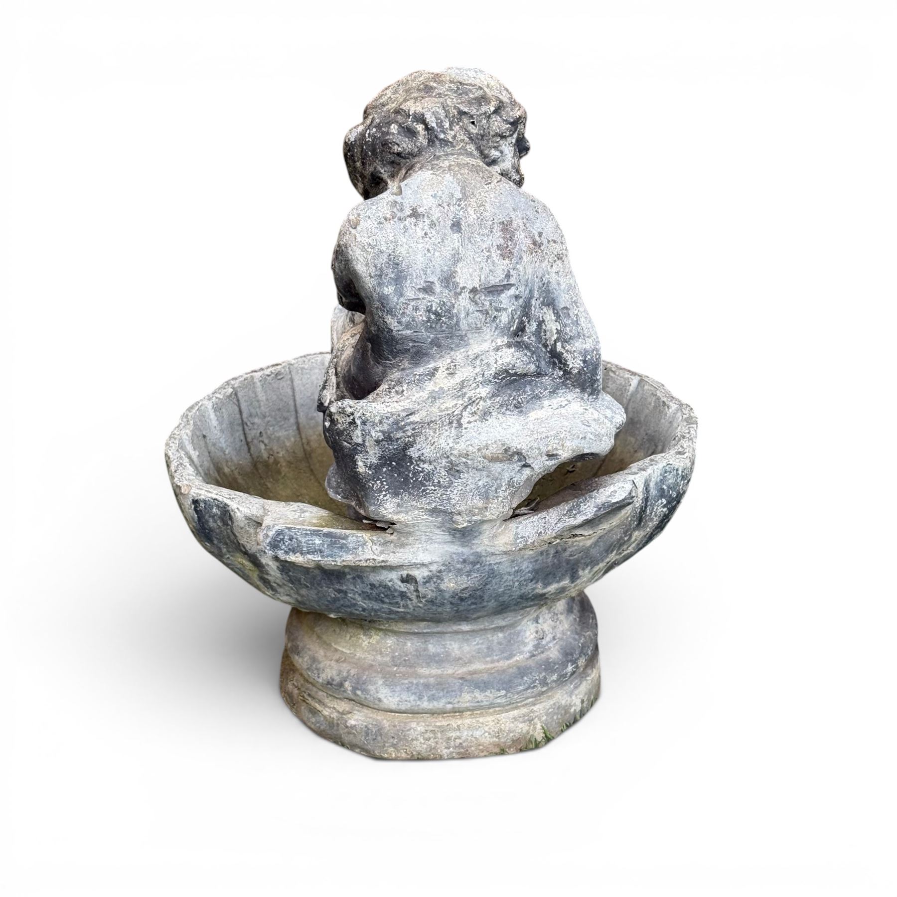 19th century lead bird bath depicting a seated cherub on a shell
