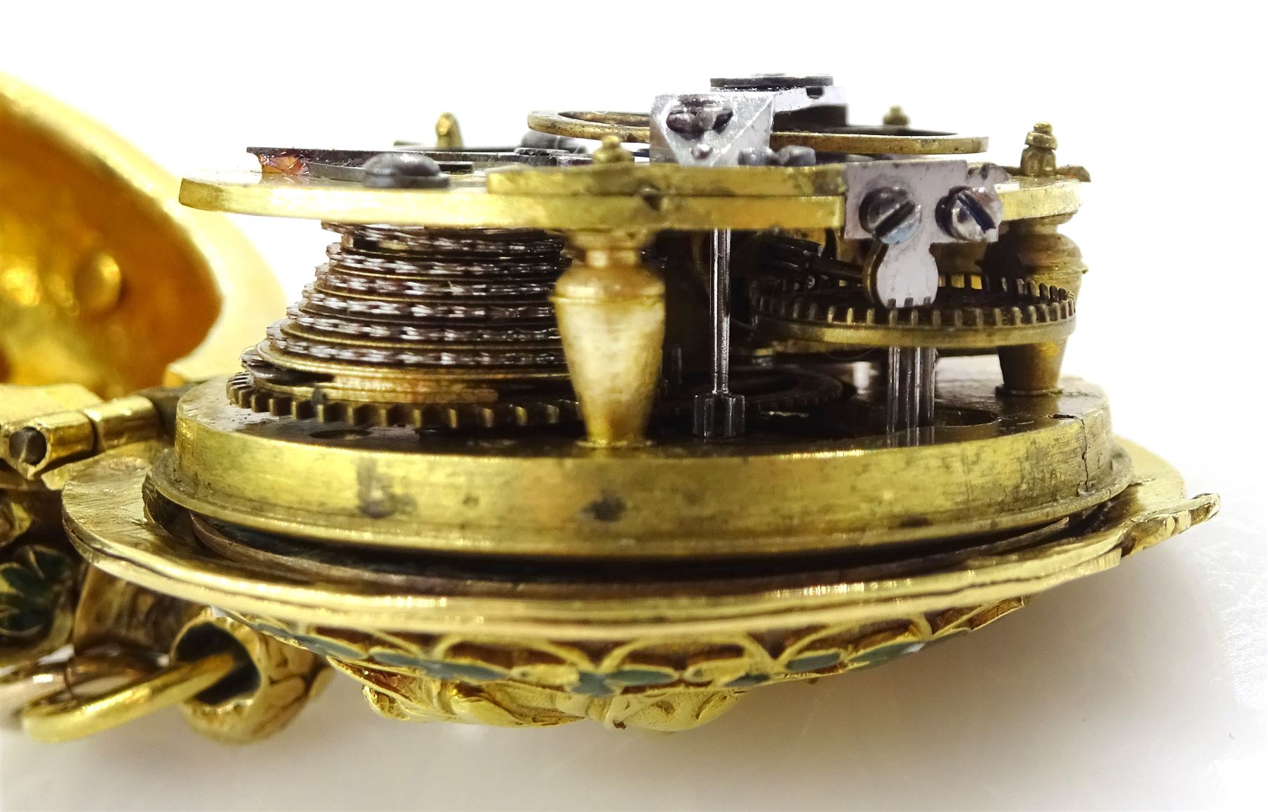 18th century 18ct gold fusee lever full hunter repousse pocket watch with later 19th century modifications to the movement, the 18th century case depicting figures in front of a tree with sheep in the background and enamelled leaf surround, the reverse depicting a classical scene with figures and horses, the side with enamelled bird and foliate decoration, 18th century polychrome dial with gilt hour hand, Roman numerals and quarter hour markers.