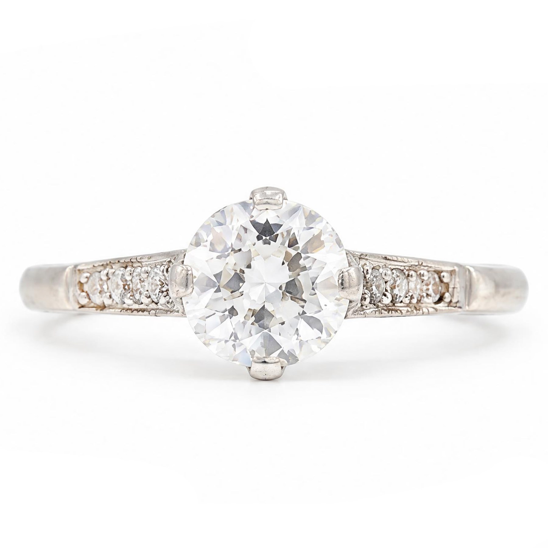 Early 20th century platinum diamond ring, four claw set with a single old cut diamond of approx 0.90 carat and diamond set shoulders, stamped Plat, inscribed with initials and dated 7.6.28