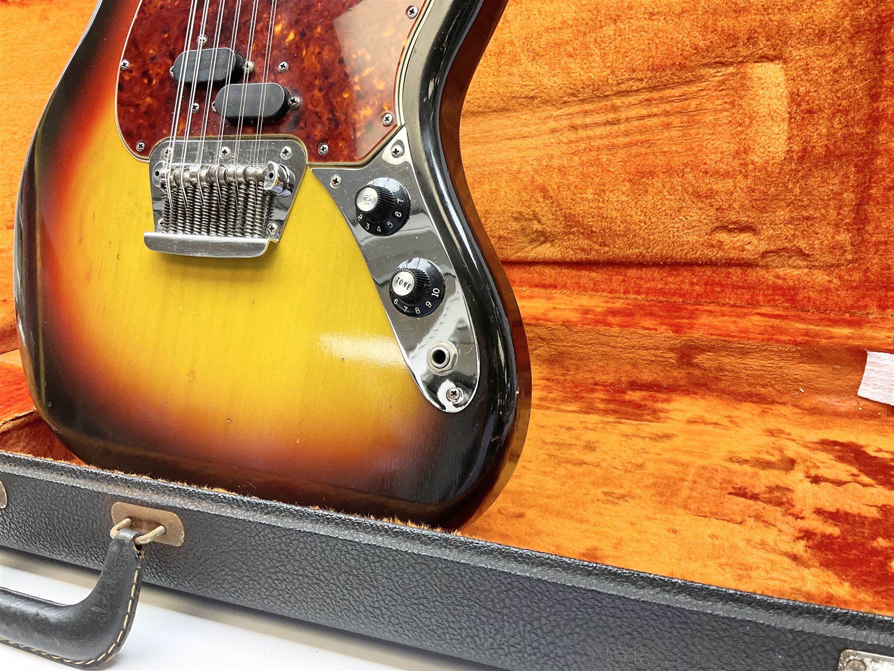 Fender three-tone Sunburst 12-string electric guitar c1965/6 Fullerton USA, with alder body and maple neck, the Indian rosewood fretboard with twenty-one frets and pearloid dot markers, fender electric XII bridge, F-stamp tuners (non-original), two split single coil pick-ups, master volume and tone and four-way switch, serial no.129730, L108cm; in original Fender case bearing label for Rivington Guitars New York with copy of original invoice; together with GuitarKes set-up and service certificate dated October 2021
