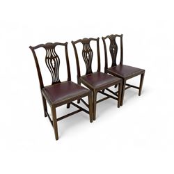 Set of six (4+2) 19th century Chippendale-design mahogany dining chairs, shaped cresting rail over pierced bulbous vase-shaped splat, burgundy leather upholstered seats with brass stud trim, on square tapering supports united by H-stretchers