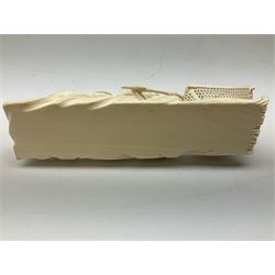 Japanese Tokyo School one piece ivory okimono, 19th century, carved as two fisherman with a net, H6cm, L15.5cm