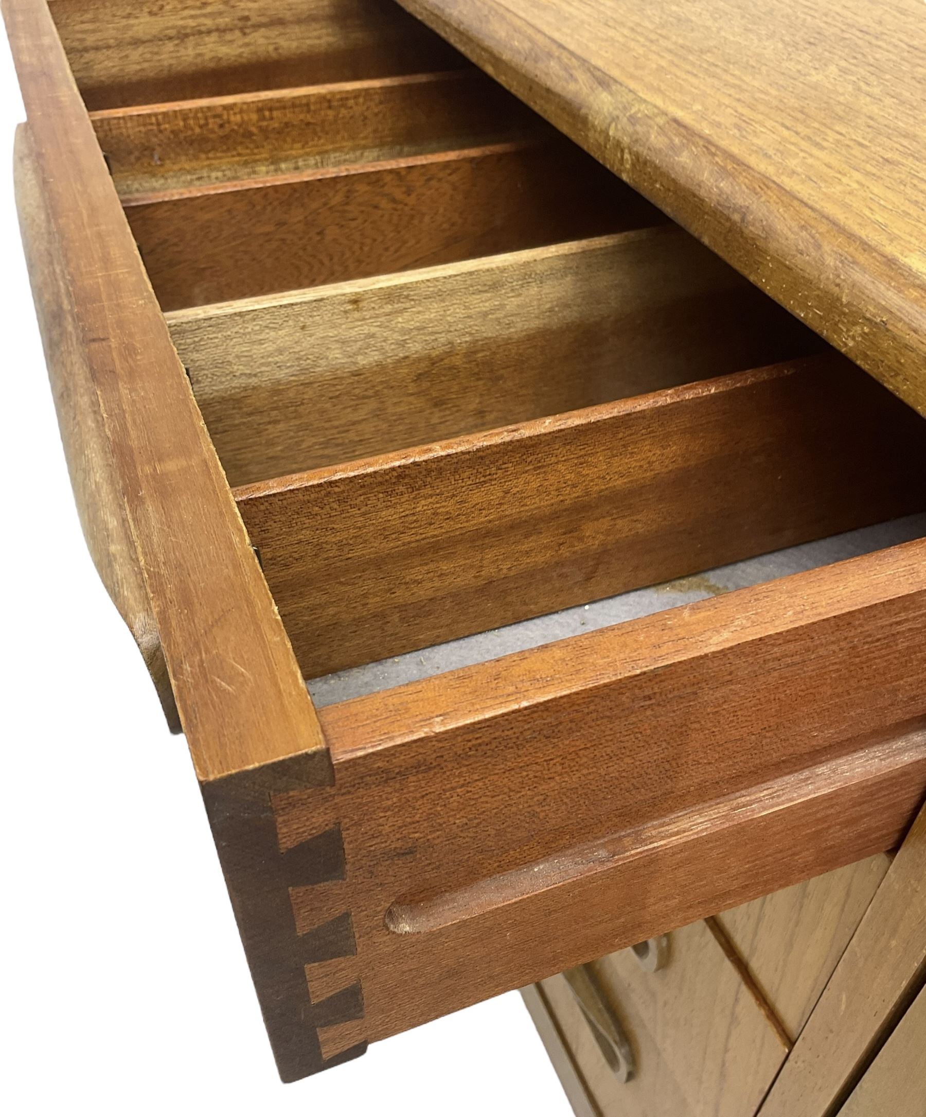 G-Plan – teak sideboard, four central drawers flanked by two double cupboards, enclosed by panelled doors 