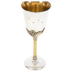 Late 20th century silver goblet, commemorating the birth of HRH Prince William of Wales 21st June 1982, the goblet of plain form, with parcel gilt daffodils and ribbons atop a parcel gilt column stem upon a circular foot, hallmarked St James House Company, London 1982, H19.5cm