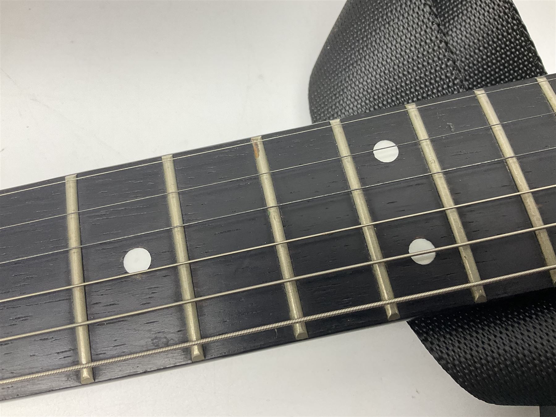 Encore black electric cut-away guitar L96cm; and Spanish Victor Garcia model 187 acoustic guitar, bears label dated 1972 L99cm; each in soft carrying case (2)