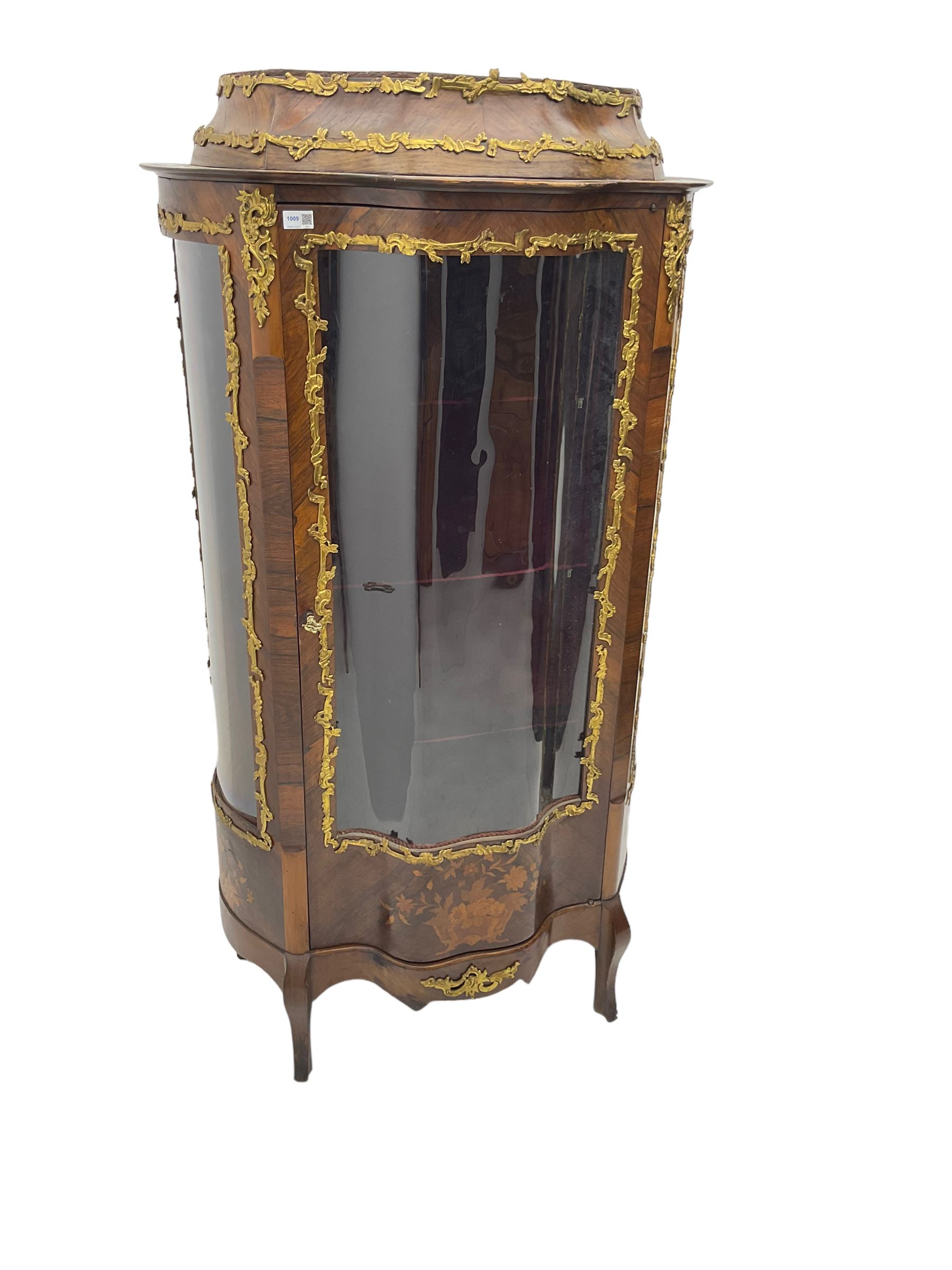 Early 20th century French kingwood vitrine or display cabinet, decorated with applied foliate cast band, serpentine glazed door and sides, inlaid with marquetry decoration of floral bouquets and branches, cartouche mounts to the apron, raised on cabriole supports