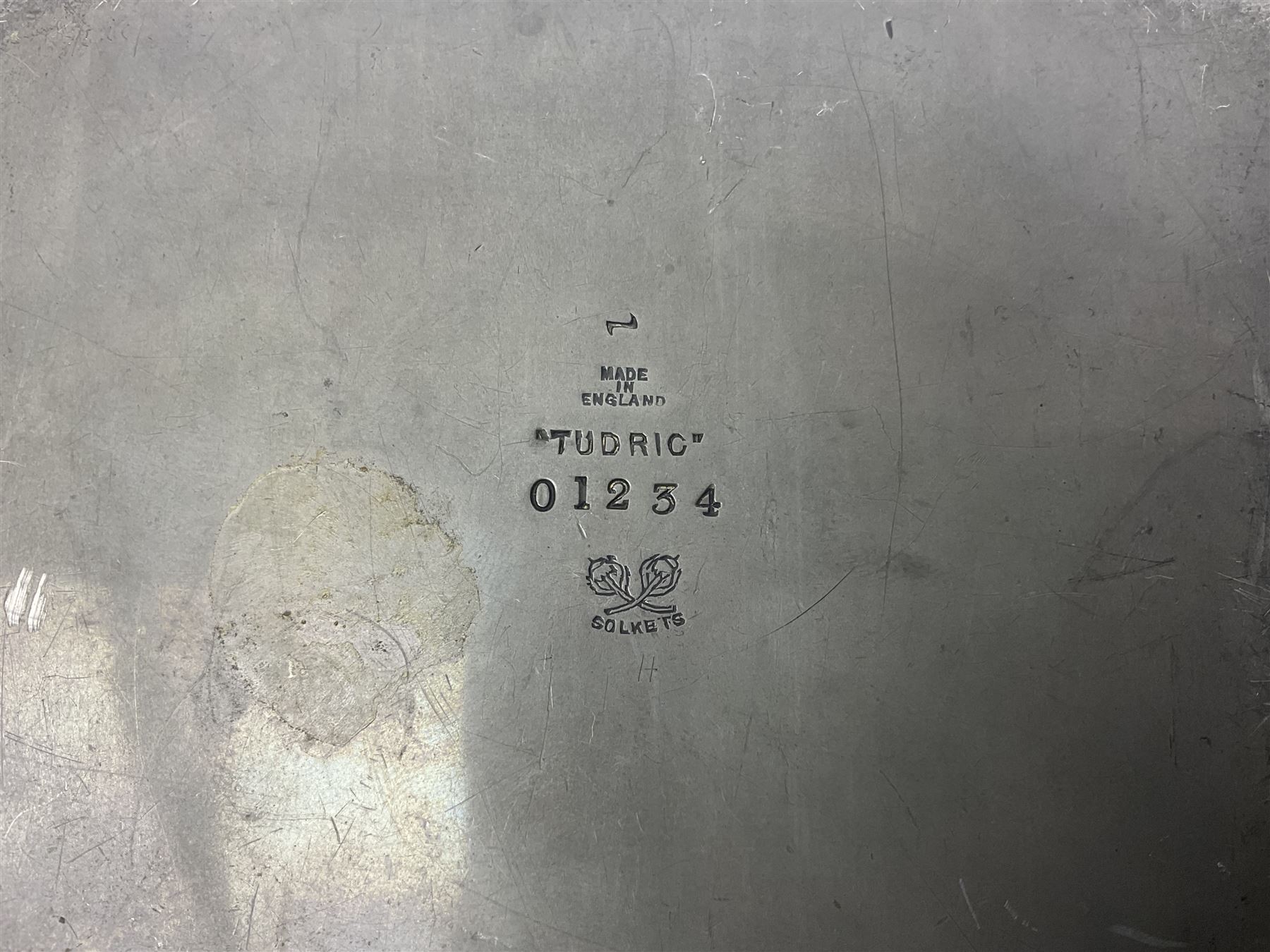 Liberty & Co Tudric pewter cigarette box, of plain rectangular form, with planished decoration to the slightly domed cover, opening to reveal a softwood interior, stamped Made in England 01234 Tudric Solkets beneath, together with another cigarette box, with applied pewter panels repousse decorated throughout with flower heads and leaves, with compartmentalised softwood interior, largest H5.5cm, W23cm