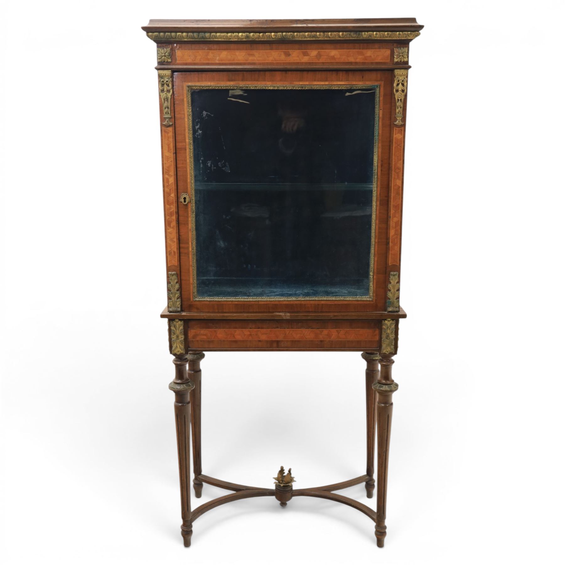 French kingwood display vitrine, rectangular glazed case with baized lined interior, parquetry banding and gilt metal bead mounts, applied gilt metal foliate corner mounts, raised on turned supports united by shaped undertier stretchers