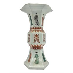 Chinese Kangxi gu vase, of hexagonal form with fluted rim, decorated in polychrome enamels with a male figure to each panel and red character marks to centre, with painted red leaf mark beneath, H32.5cm