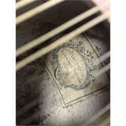 Late 19th/early 20th century Italian lute back mandolin with segmented back and spruce top; bears maker's label for Pietro Tonelli Napoli; together with a mandolin instruction booklet and a folding music stand L60.5cm