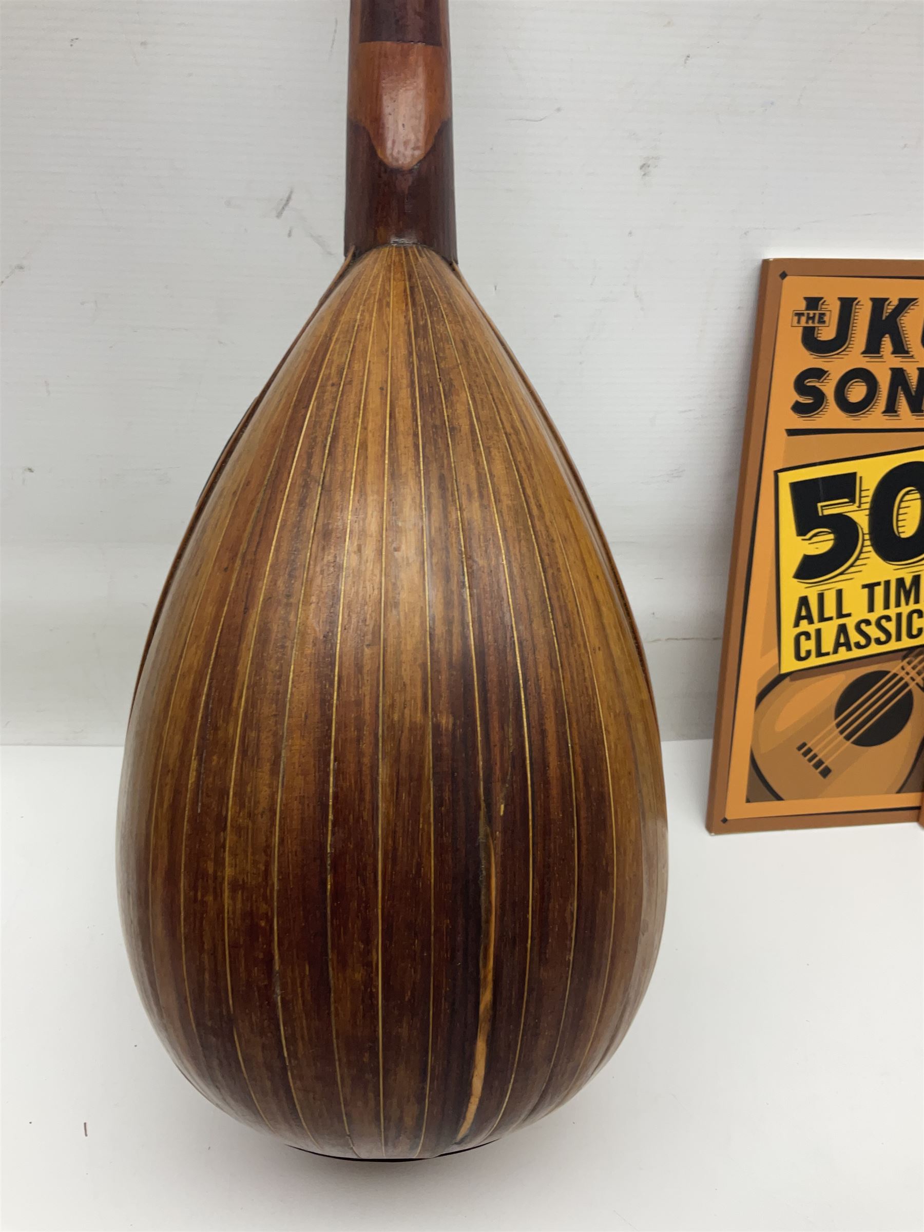 W.D. Keech banjolele pat.219720/23 with etched signature to the back; serial no.A12082 L55cm; and a restored Italian mandolin with segmented lute back; together with three music books