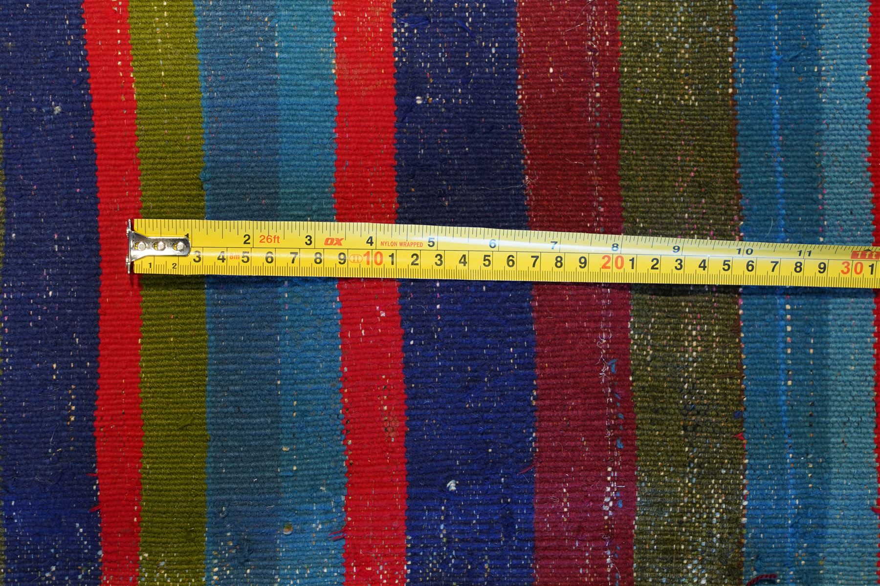 North East Persian Turkoman saddle bag, traditional double pouch form, each panel woven with vertical bands of small geometric motifs on ivory ground, framed by multiple horizontal borders of angular tribal ornament of hooked devices and steeped lozenges, reverse with stripped coloured flatweave bands 