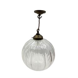 Set of two small and two large pendant lights, each with clear glass spherical shade with moulded swirl pattern, suspended from twisted cords, brass ceiling rose