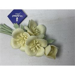 Seven Lladro flowers, comprising Japanese Camelia on base no 5181, Yellow Begonia on base no 5186, Miniature Begonia on base no 5188, Chrysanthemum on base no 5189, California Poppy no 5190.B, Miniature Begonia 5188.B and White Carnation no 5184.B, together with Lladro Spanish Joining pack with 17616 Winter Bell, Additional Lladro parasols and flowers etc 