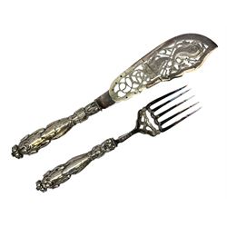 Pair of Victorian fish servers by Henry Atkin of Sheffield, the hallmarked silver handles modelled as stylised fish and reeds mounted to ornately engraved silver-plate pierced fork and knife blade, longest L33cm