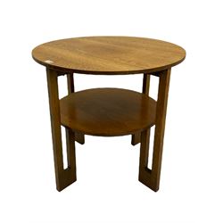 Early 20th century circular coffee table, angular supports joined by undertier