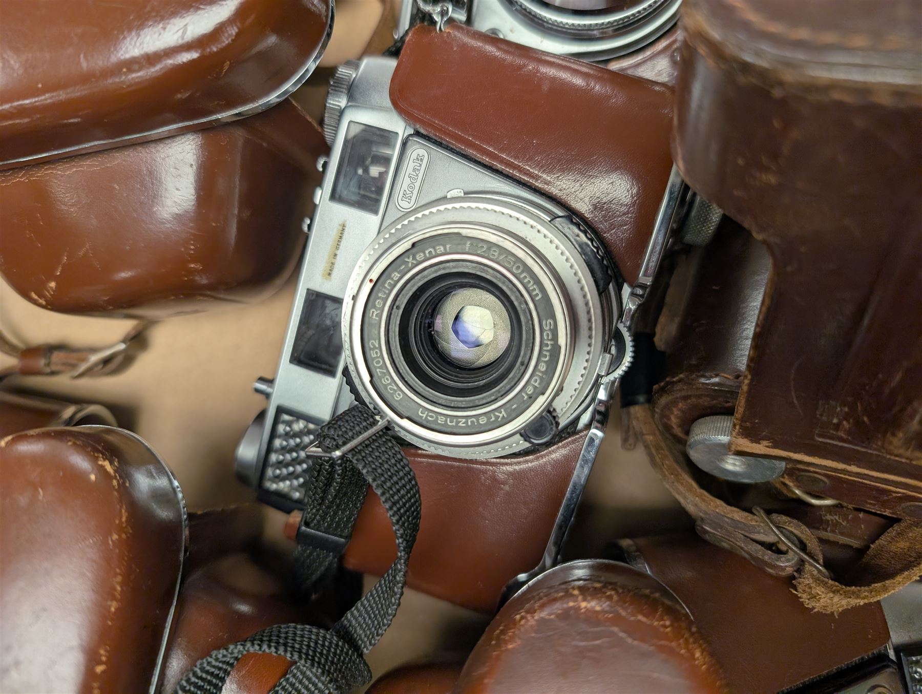 Eight Kodak Retinette cameras and similar, including IA, IB, IIIS models, most in leather cases