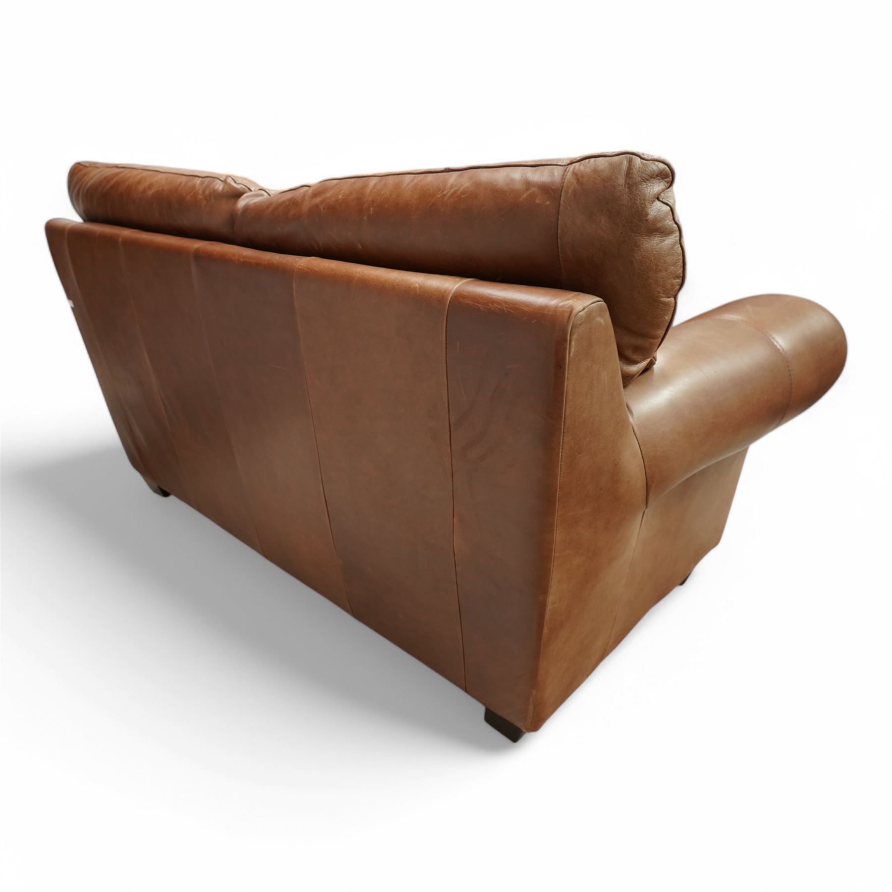 Two-seat hardwood-framed sofa, traditional shape with rolled arms, upholstered in tan leather, on block feet