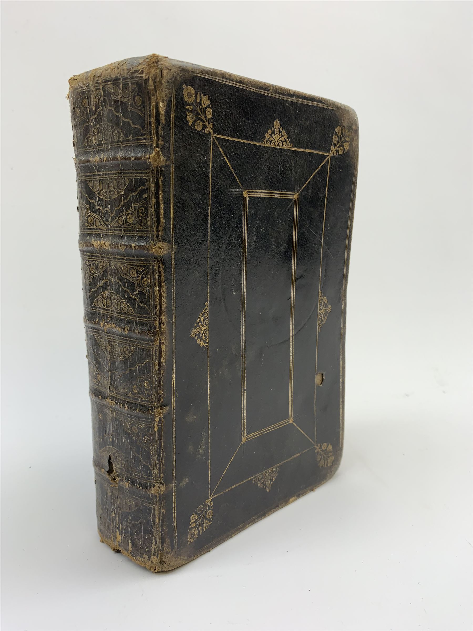 Early 18th century Holy Bible. 1711. London. Printed by The Assigns of Thomas Newcomb and Henry Hills, deceas'd. Printers to the Queens Most Excellent Majesty. Engraved title page. Red lined pages. Full tooled leather/gilt binding with aeg.