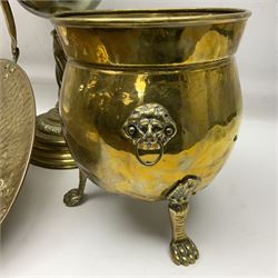 Brass log basket, with swing handle, upon four cast foliate feet, together with a brass planter, of circular bellied form, with lion mask handles and upon three paw feet and a brass oil lamp, with chased and twisted stem and pink frosted frilled  glass shade, lamp H56cm