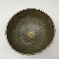 Copper pedestal punch bowl, with planished decoration with twin lion mask and ring handles and applied coins, H18cm