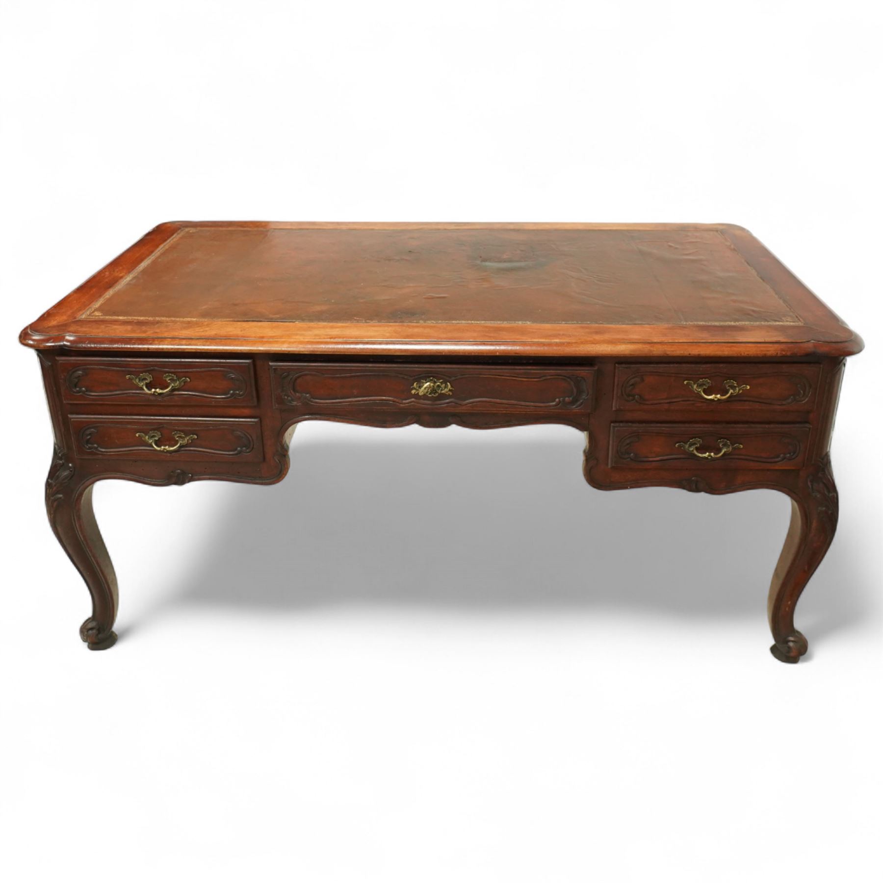 19th-century French mahogany Bureau Plat, inset tooled leather top over three frieze drawers, shaped apron, and cabriole legs carved with acanthus detail 
