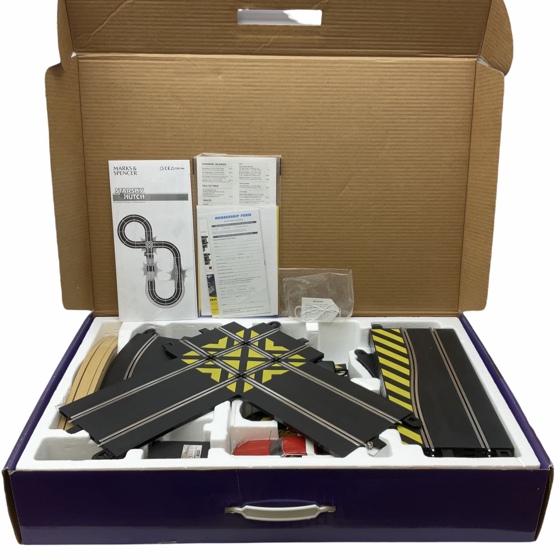 Scalextric - Marks & Spencer Starsky & Hutch set with '76 Gran Torino and Chevrolet Corvette cars, boxed; an earlier Tri-ang Scalextric 'Set 30' Model Motor Racing set containing Lotus and Cooper racing cars with controllers, track, figures and instruction pack, boxed; and a Scalextric catalogue Fifth edition c1964