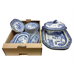 Collection of blue and white willow pattern dinnerwares, to include a covered tureen, two meat platters, dinner plates, dishes etc