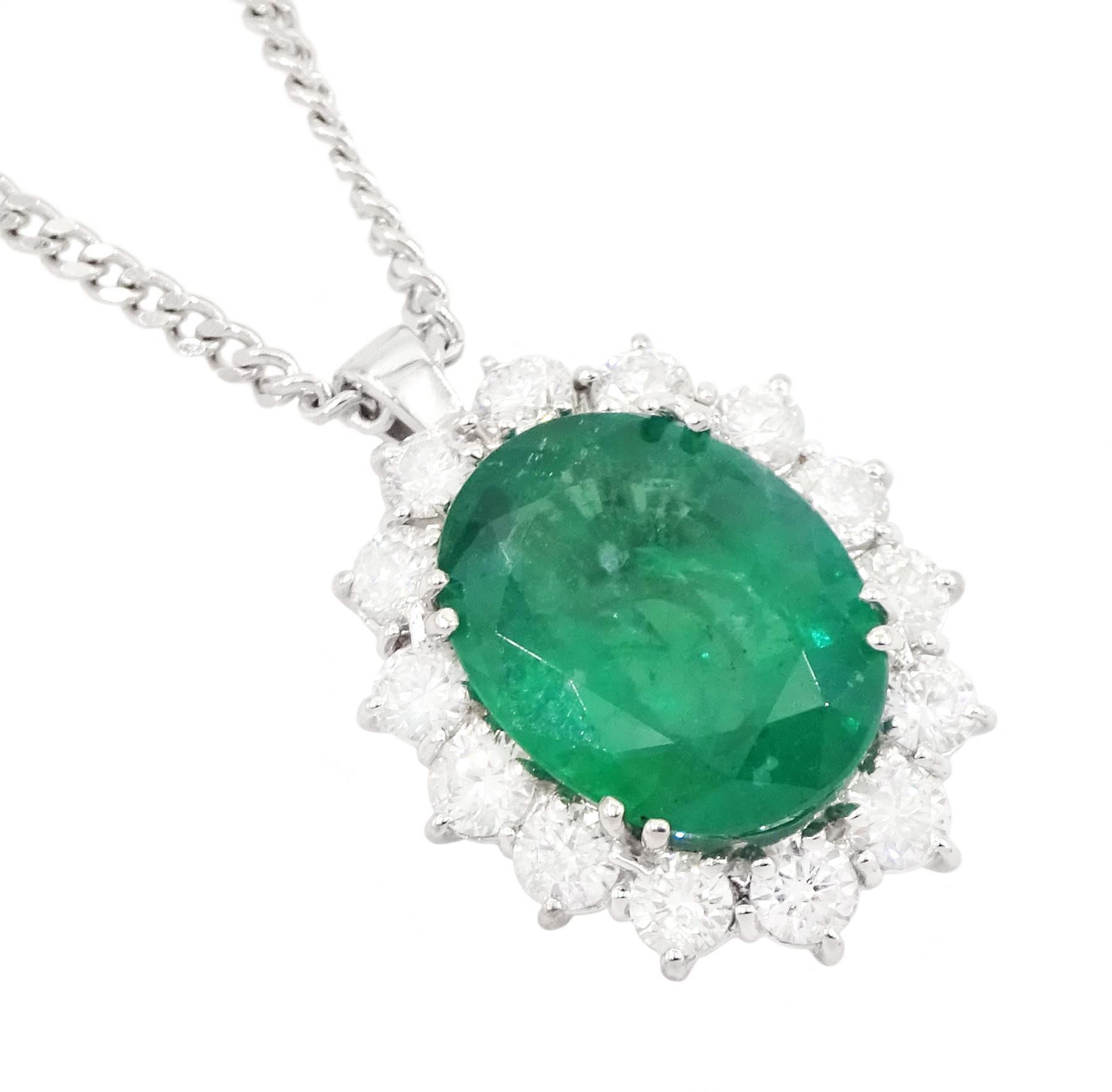 18ct white gold emerald and diamond cluster pendant necklace, single oval cut emerald of approx 4.00 carat, surrounded by fourteen round brilliant cut diamonds, hallmarked, total diamond weight approx 0.85 carat