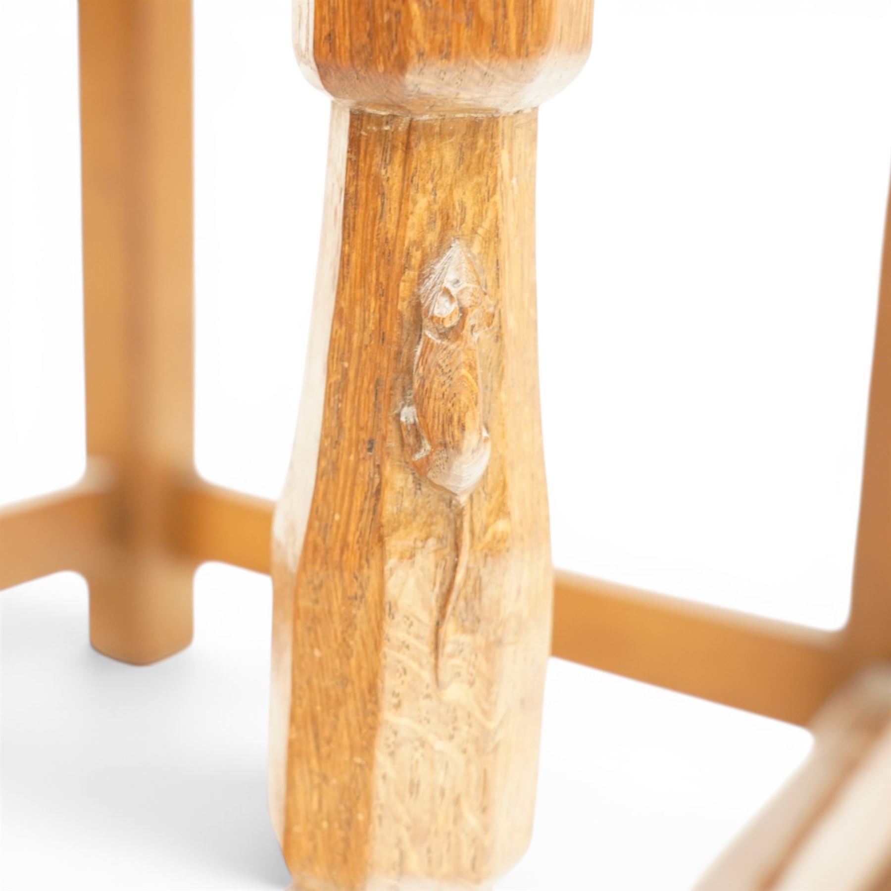 Mouseman - 1940s oak side chair, the slat-back over a slung leather seat, raised on octagonal front supports united by box stretcher, carved with slim mouse signature, by the workshop of Robert Thompson of Kilburn