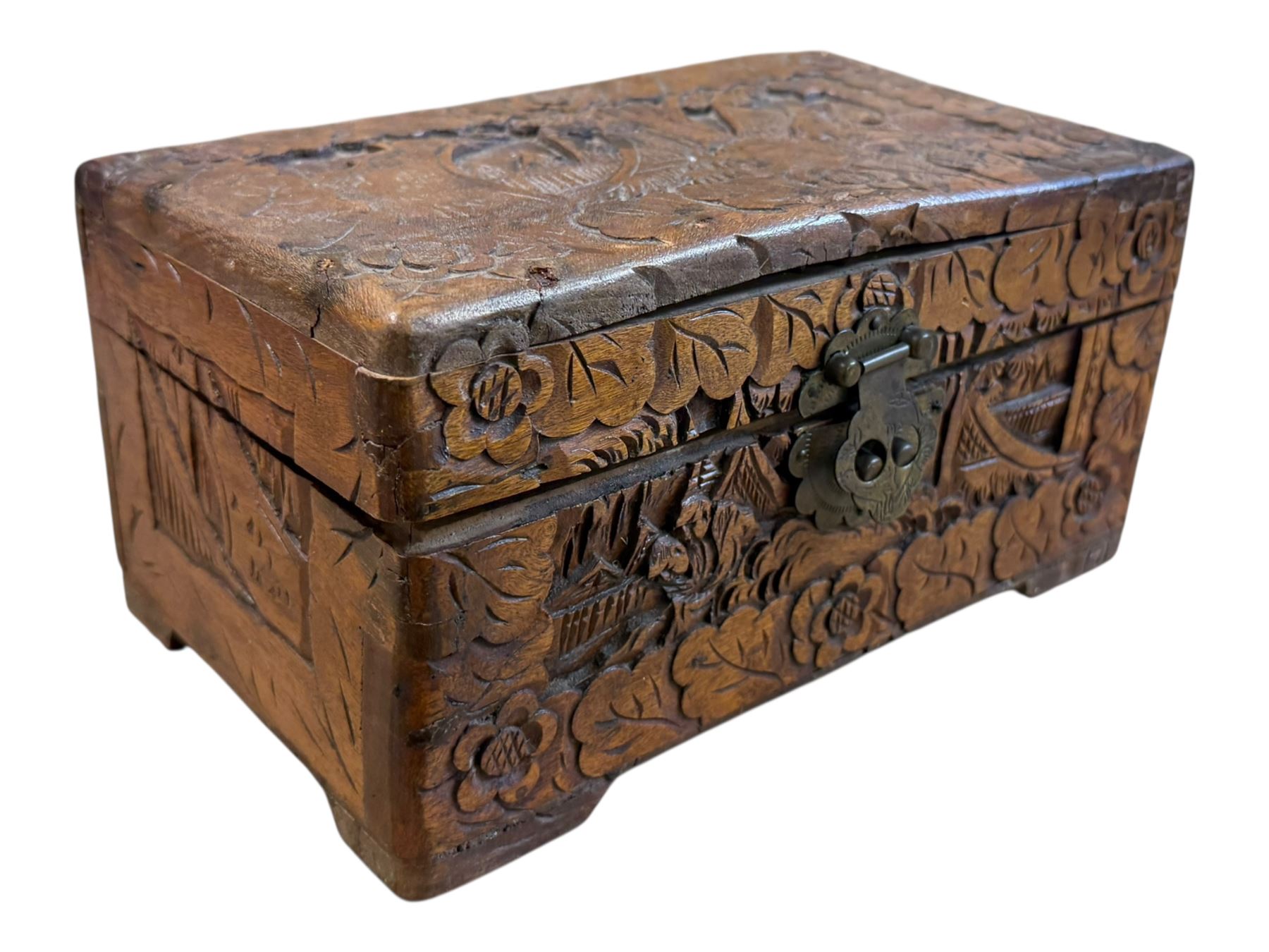 Approximately 115 grams of Great British pre-1947 silver coins, and further pre-decimal coins, housed in a miniature carved camphor wood chest