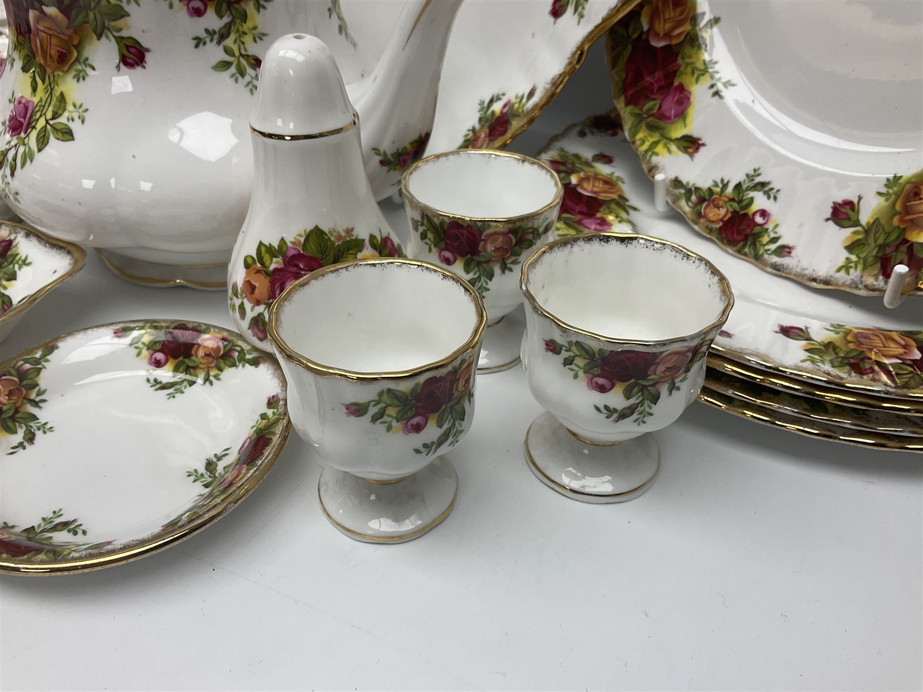 Royal Albert Country Roses pattern part tea and dinner service, to include teapot, four cups and saucers, four dessert plates, cake plate etc, (41)