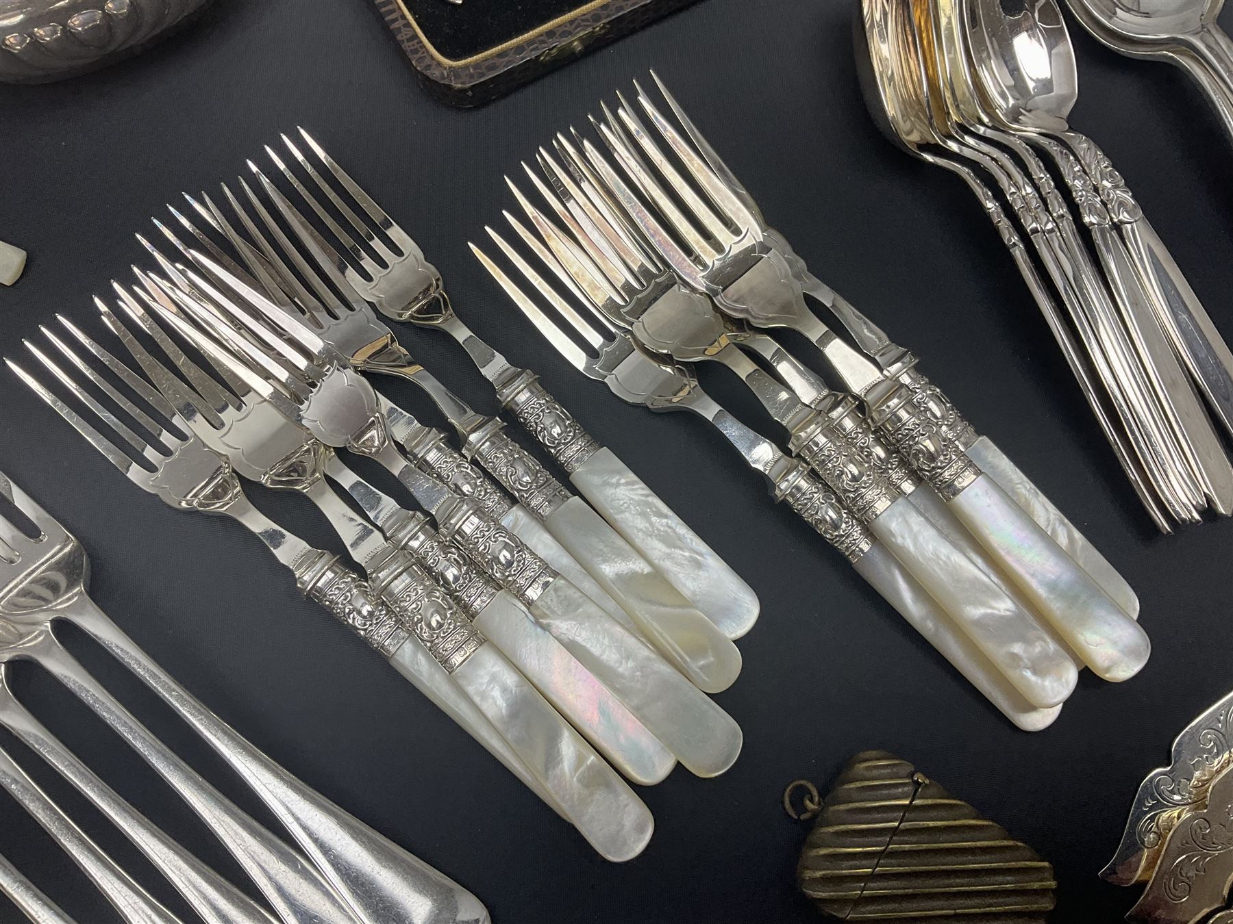 Mother of Pearl handled cutlery, with silver ferrules, comprising six fish knives and forks and six fruit knives and forks, the ferrules hallmarked Yates Brothers, Sheffield 1905, together with silver plated Edwardian three piece tea service and other flatware 