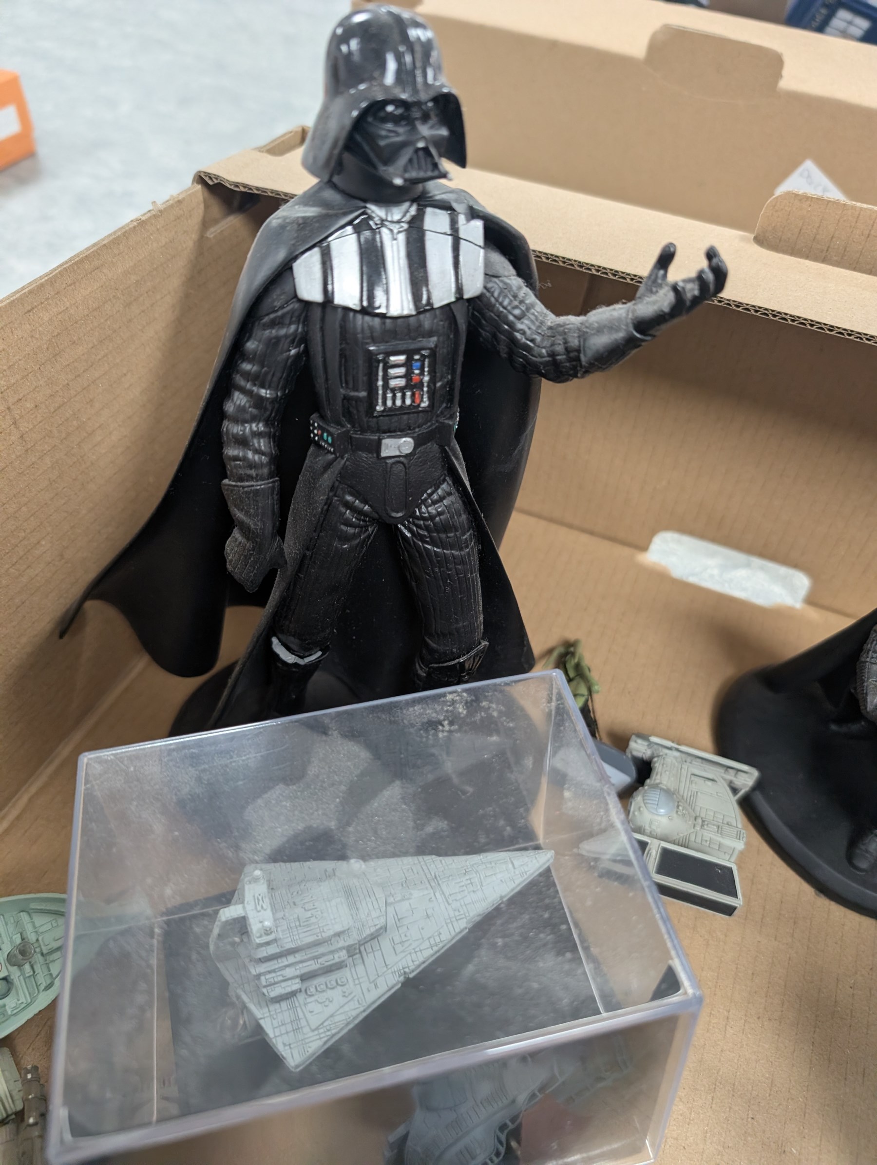 Collection of DeAgostini Star Wars figures, including two limited edition Darth Vader figures, diecast vehicles and figures and miniature helmets