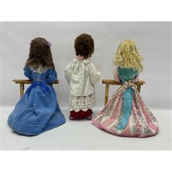 Anna Meszaros Hungary - two hand made needlework figurines, each of a young girl kneeling by an alter rail praying H28cm; together with another similar of a chorister H29cm (3)  Auctioneer's Note: Anna Meszaros came to England from her native Hungary in 1959 to marry an English businessman she met while demonstrating her art at the 1958 Brussels Exhibition. Shortly before she left for England she was awarded the title of Folk Artist Master by the Hungarian Government. Anna was a gifted painter of mainly portraits and sculptress before starting to make her figurines which are completely hand made and unique, each with a character and expression of its own. The hands, feet and face are sculptured by layering the material and pulling the features into place with needle and thread. She died in Hull in 1998.