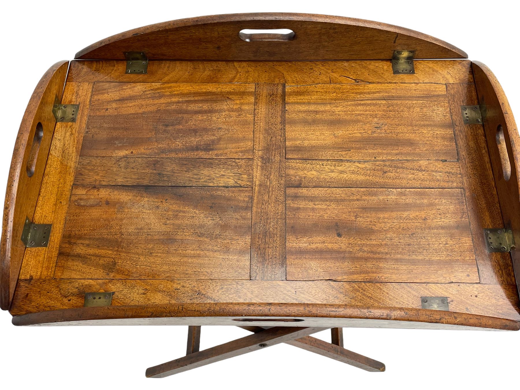 George III mahogany butler's tray on stand, the panelled tray with hinged sides pierced with handles, on folding stand