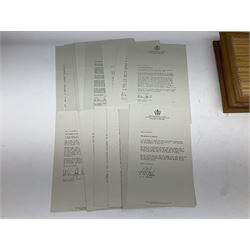 The Stamps of Royalty collection consisting of twenty-five sterling silver hallmarked stamp replicas, housed in a fitted wooden display case, with certificates, polishing cloth and certificates