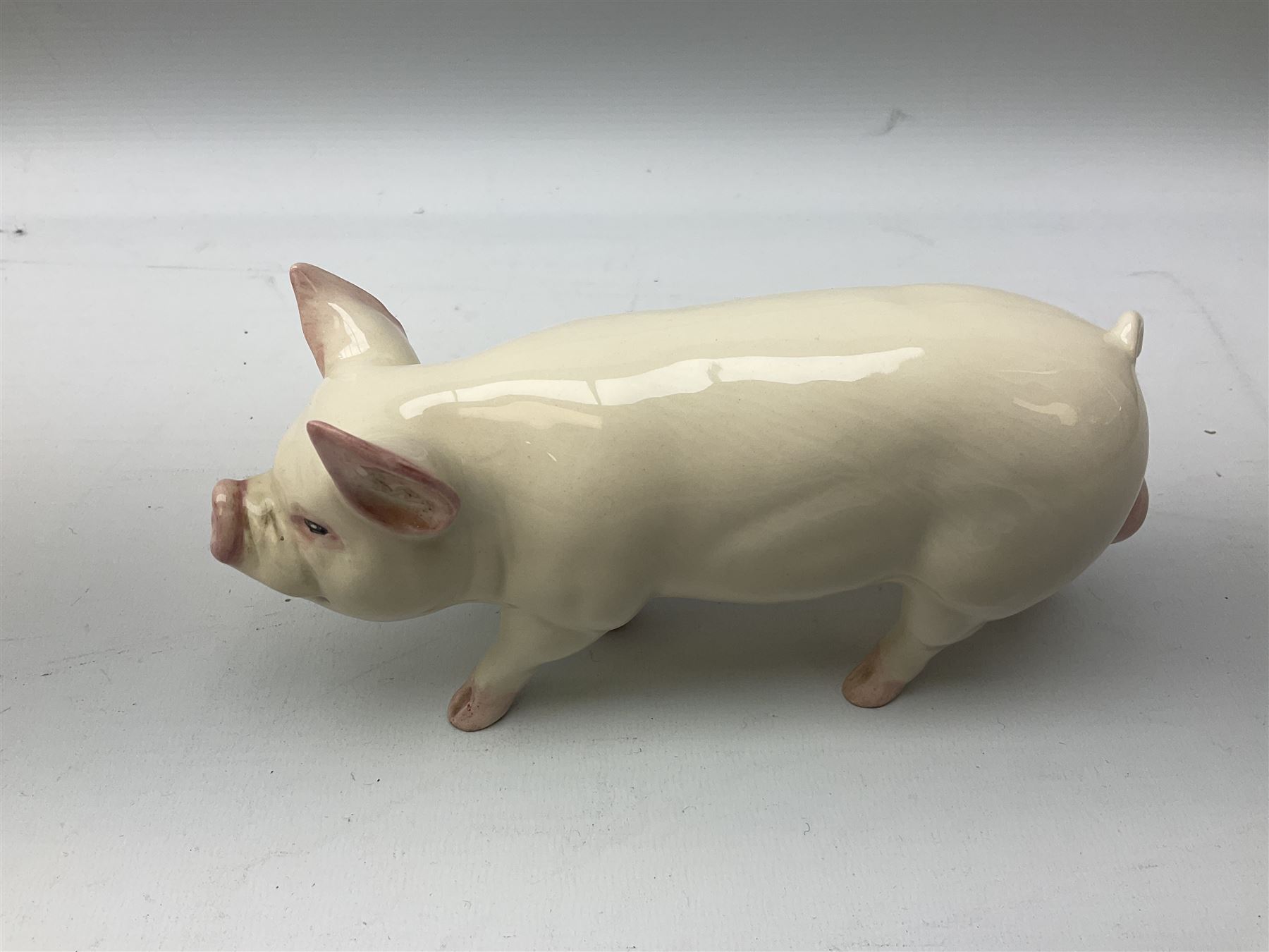 Collection of Beswick pig figures, to include John Beswick Little Likeables ‘Hide and Sleep’, white boar pig and John Beswick trio of pigs, all marked beneath (5)